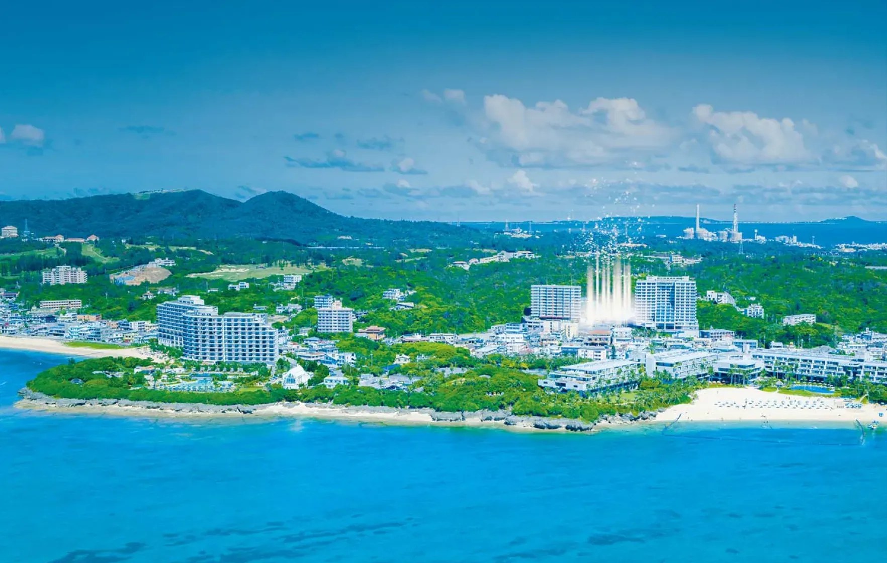 BLISSTIA SUITES & RESORT 沖縄恩納村 — 恩納村・前兼久の海岸線を空撮で捉えたロケーション、リーフの白と東シナ海の青