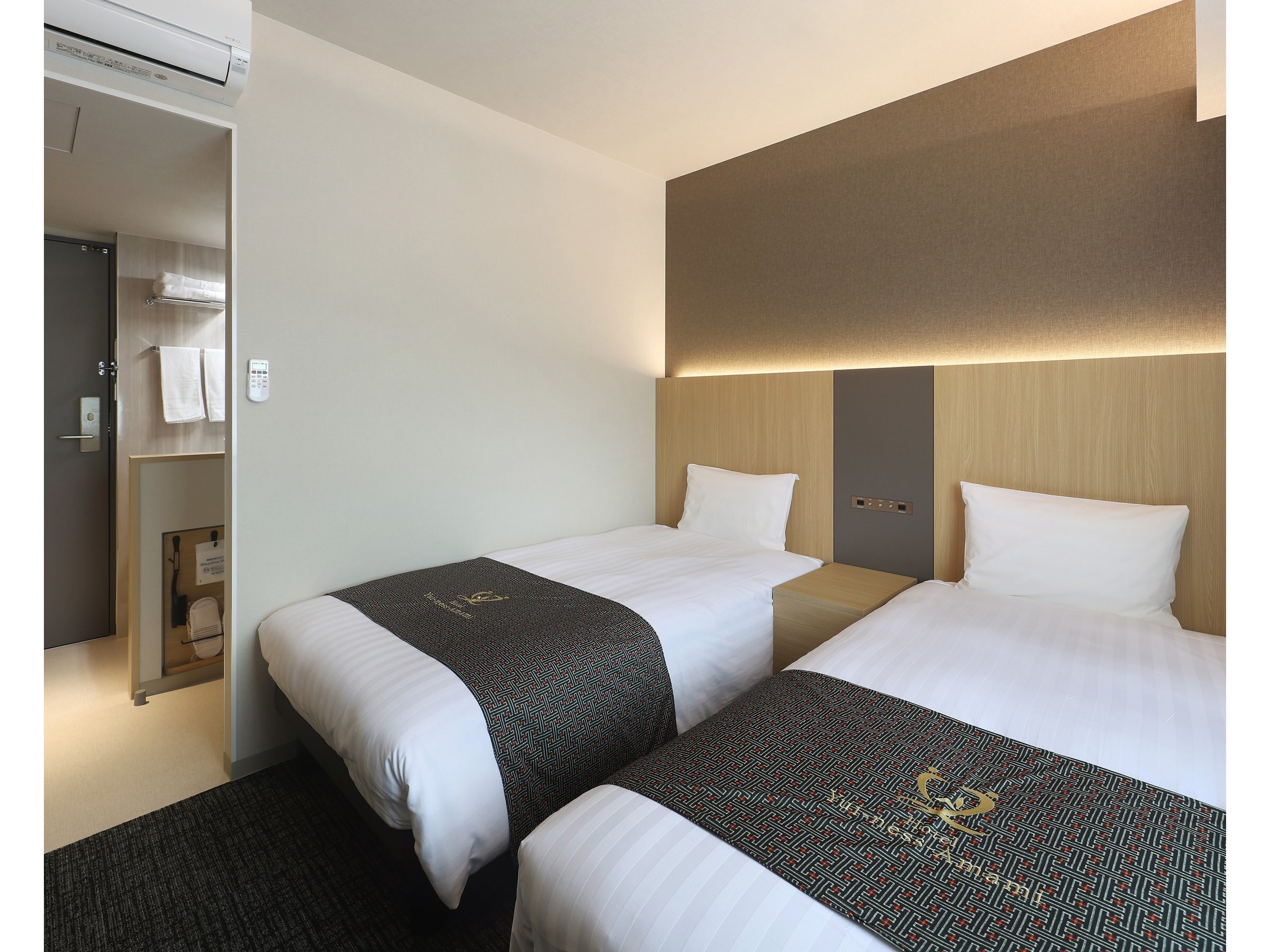 Hotel Yui-ness-Amami マリンタウン — 奄美市名瀬 · シングルベッド2台を置いた16㎡のツインルーム